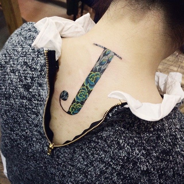 Inkspression Tattooz - W I N G A small wing tattoo with the letter ...